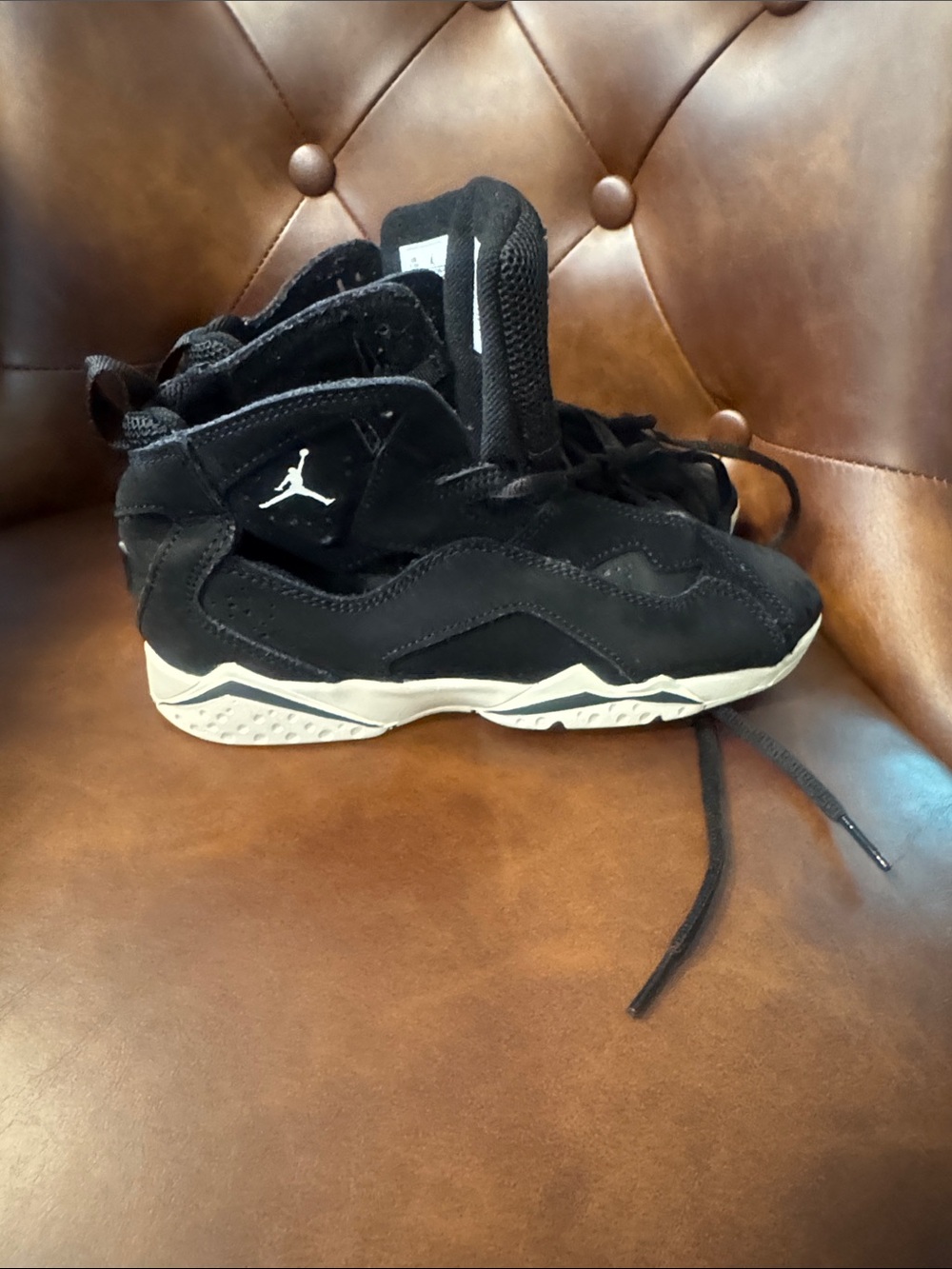 Jordan Kids Black and White High-Top Sneakers